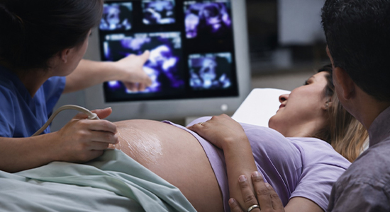 Doctor explaining fetal ultrasound image